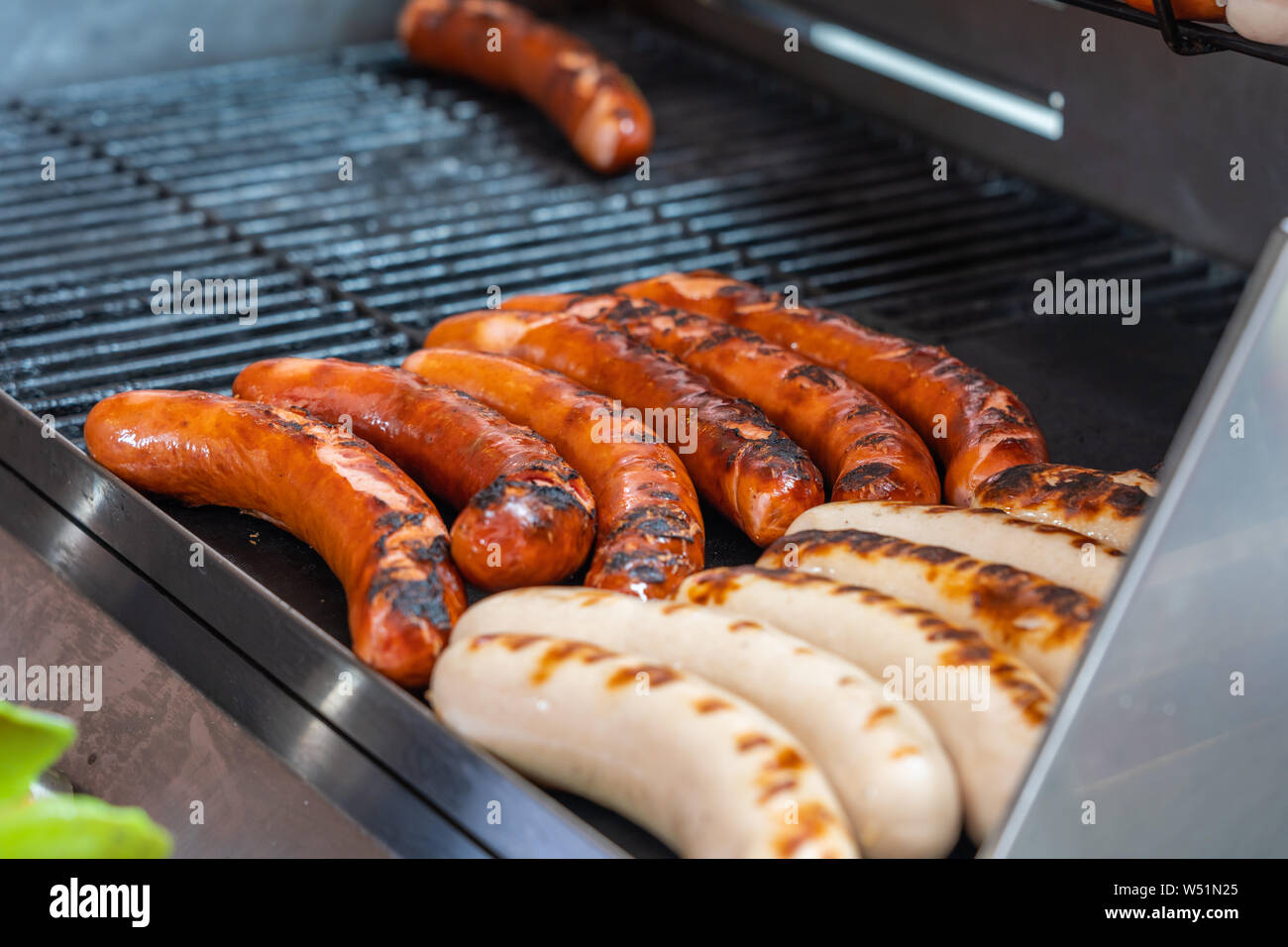Delicious Germany sausage grilling on barbecue coal Stock Photo Alamy