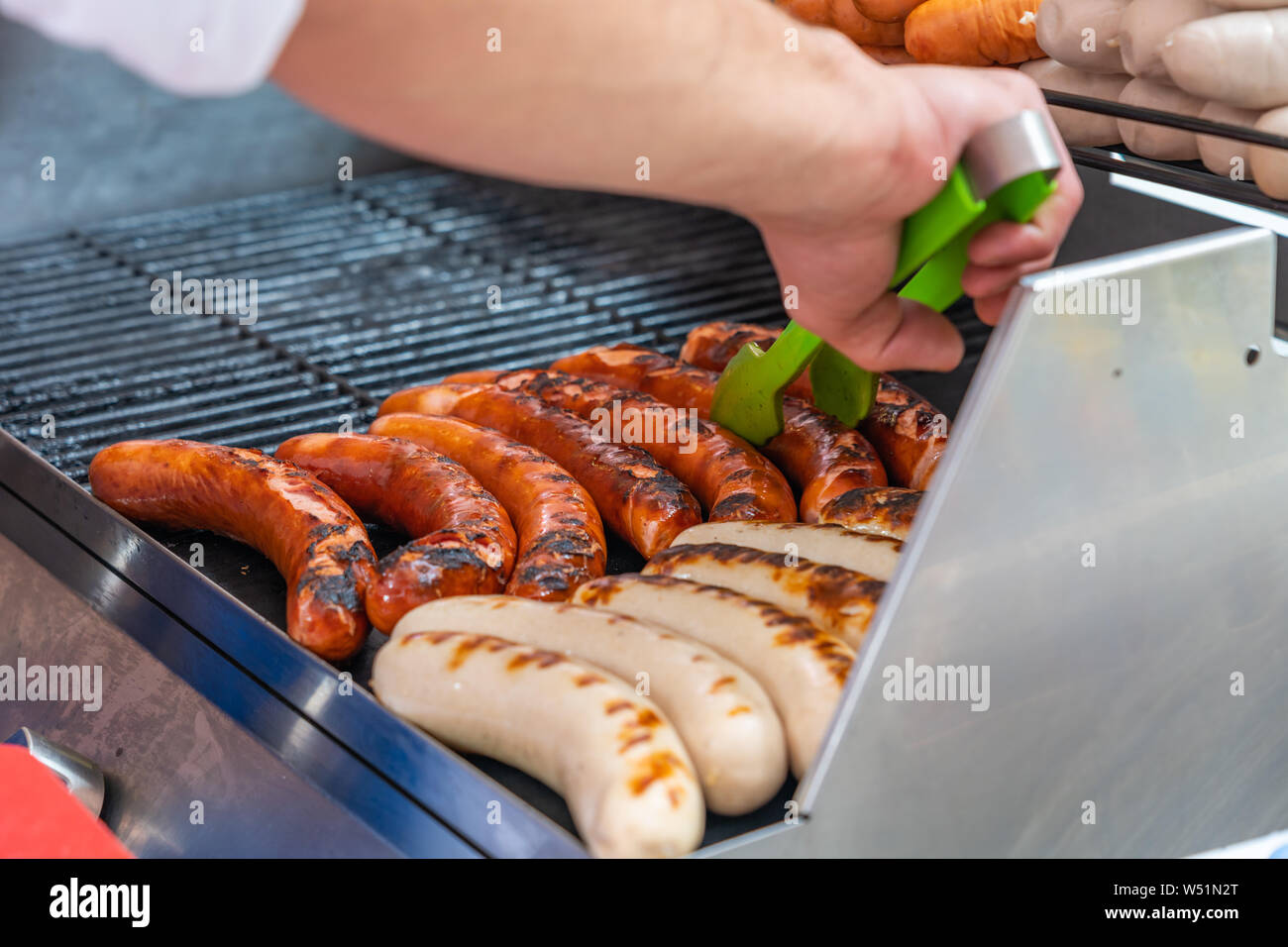 Germany sausage sizzling over coal barbecue grill Stock Photo Alamy