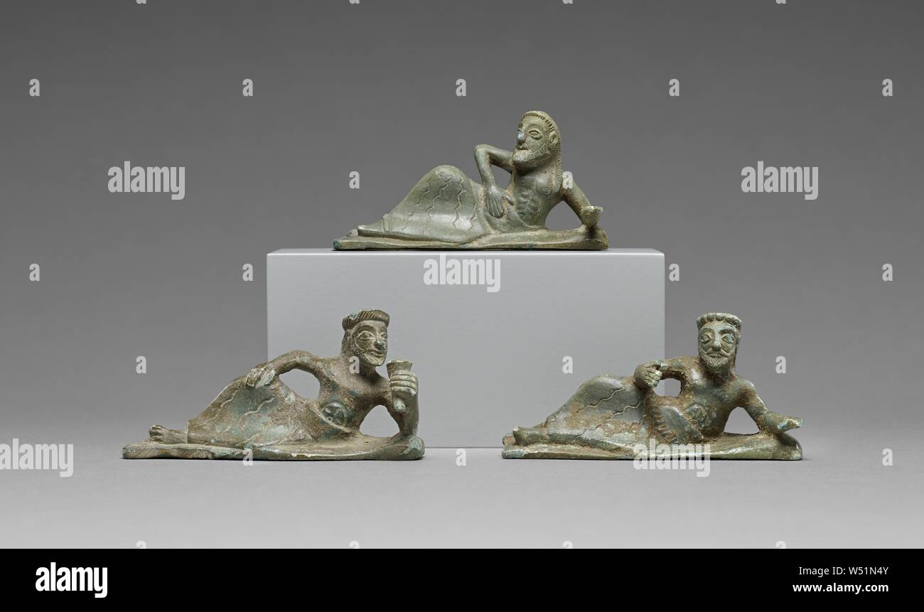 STATUETTES OF THREE BANQUETERS, 550–525 B.C., Bronze Stock Photo
