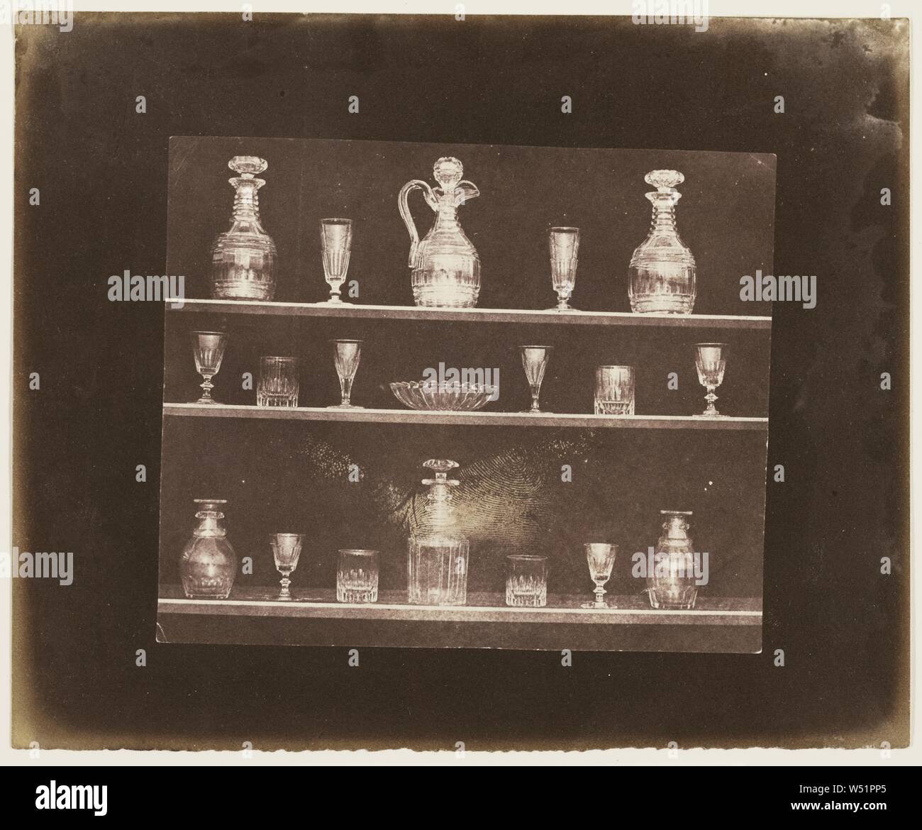 Articles of Glass on Three Shelves, William Henry Fox Talbot (English, 1800 - 1877), before June 1844, Salted paper print, 12.7 × 15.2 cm (5 × 6 in Stock Photo