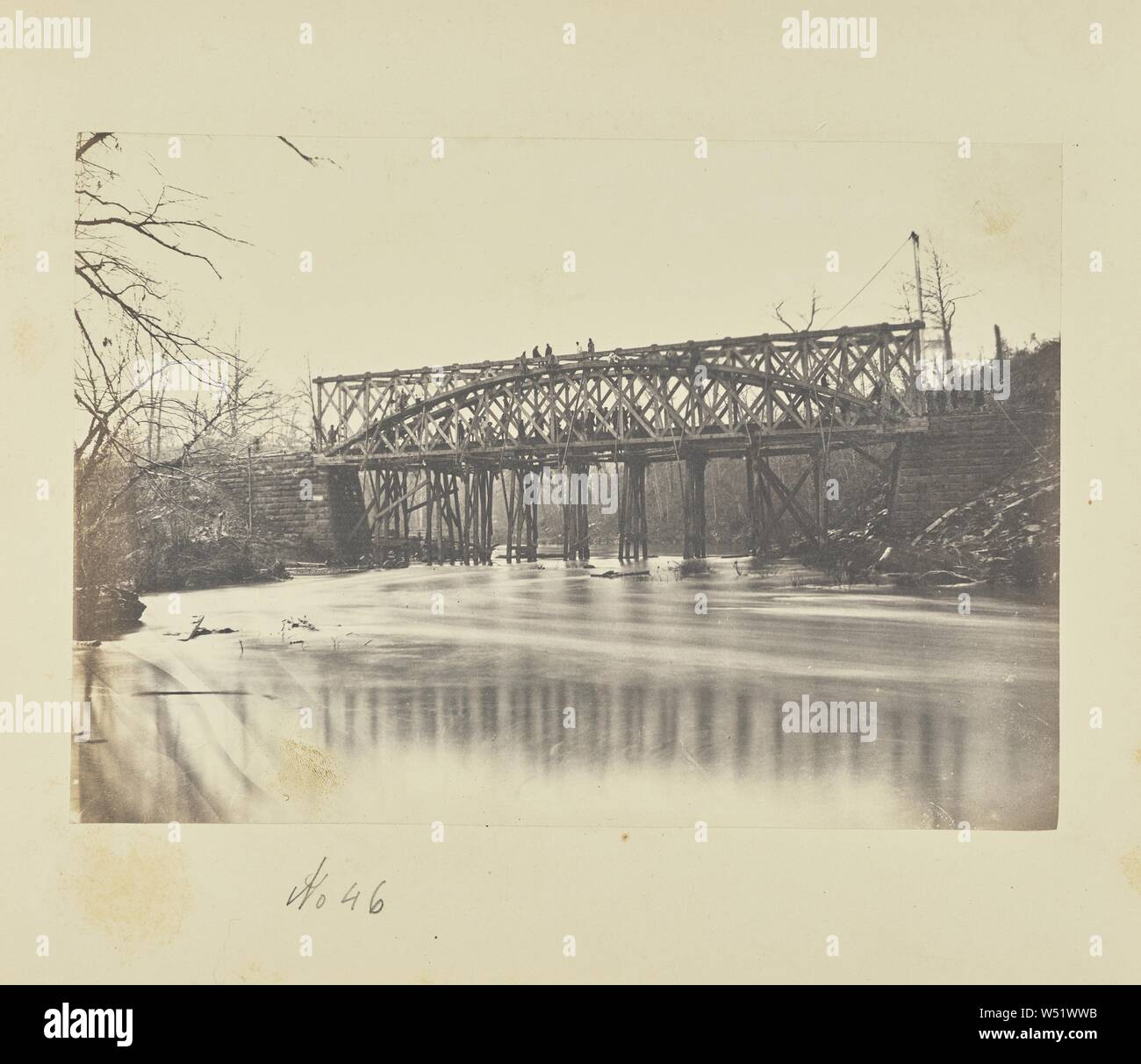 Building Military Railroad Truss Bridge across Bull Run, April, 1863, A.J. Russell (American, 1830 - 1902), Centreville, Virginia, United States, April 1863, Salted paper print, 13.7 × 19.6 cm (5 3/8 × 7 3/4 in Stock Photo