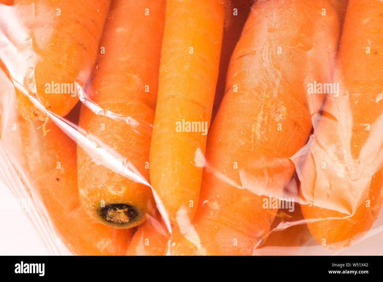 Bunch of organic Carrots packaged in plastic bag Stock Photo