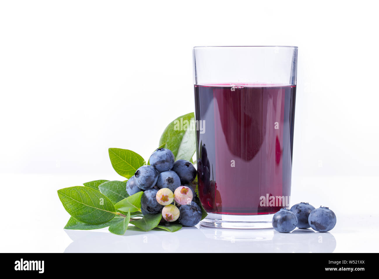 Blueberry juice and fruit on white background Stock Photo Alamy