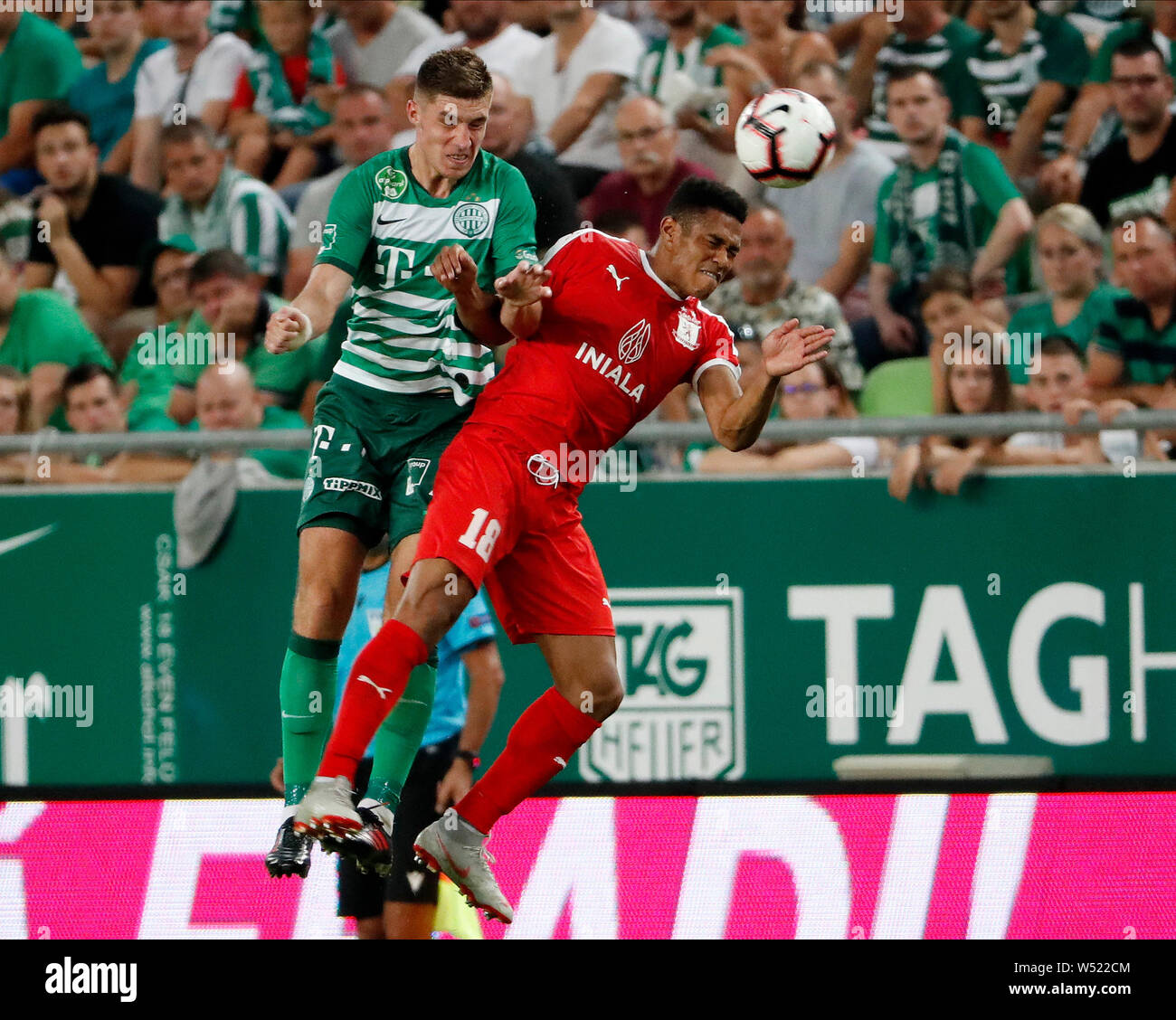 BUDAPEST, HUNGARY - JULY 24: (l-r) Danylo Ihnatenko of Ferencvarosi TC  battles for the ball in the air with Pena Beltre of Valletta FC during the  UEFA Champions League Qualifying Round match