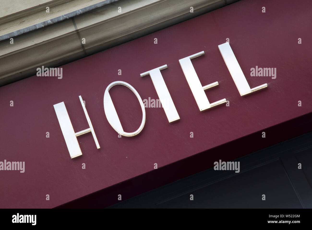 White Hotel Sign On Building Facade Stock Photo - Alamy