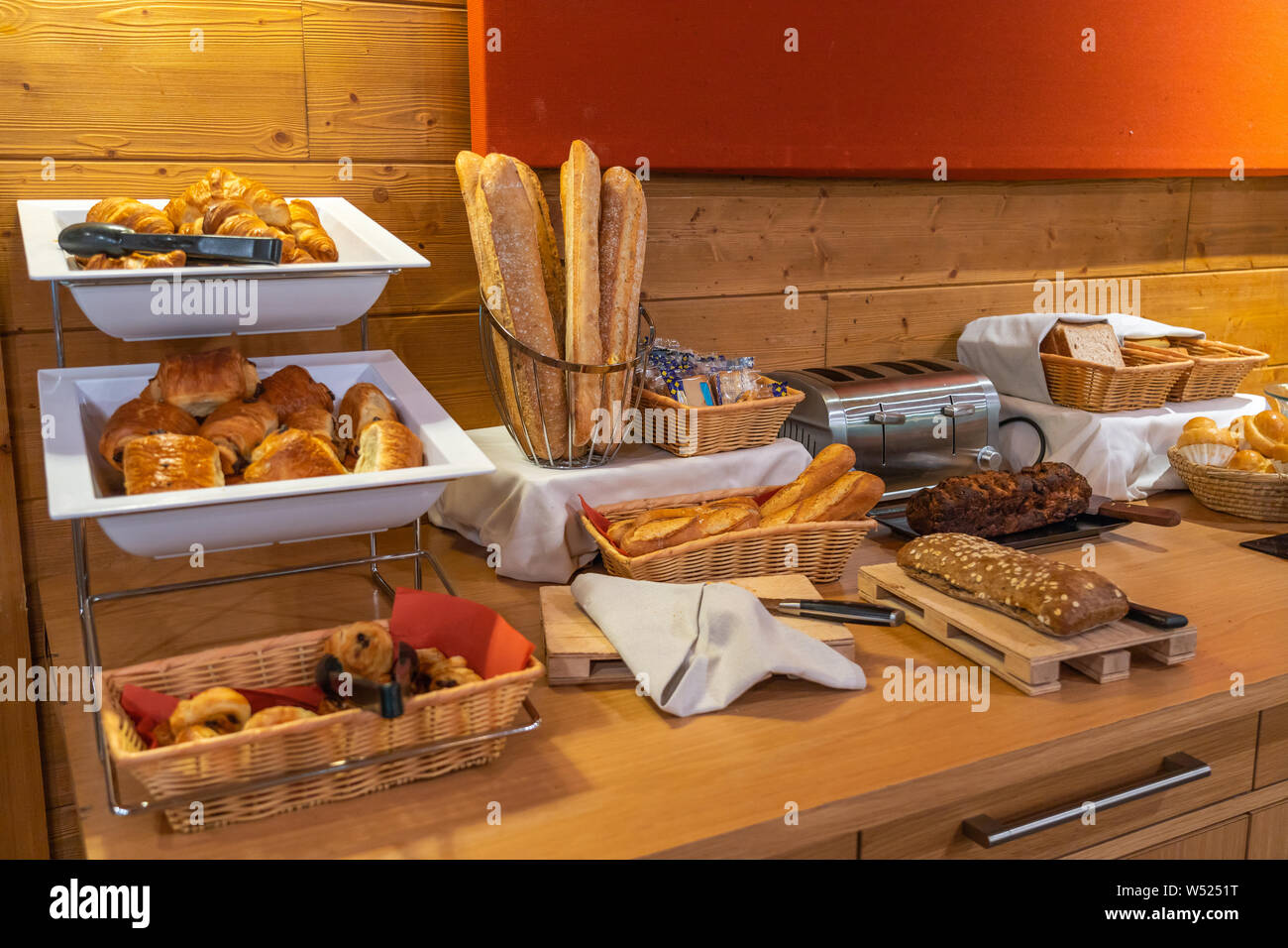 Assorted fresh pastry on table in breakfast buffet in hotel Stock Photo