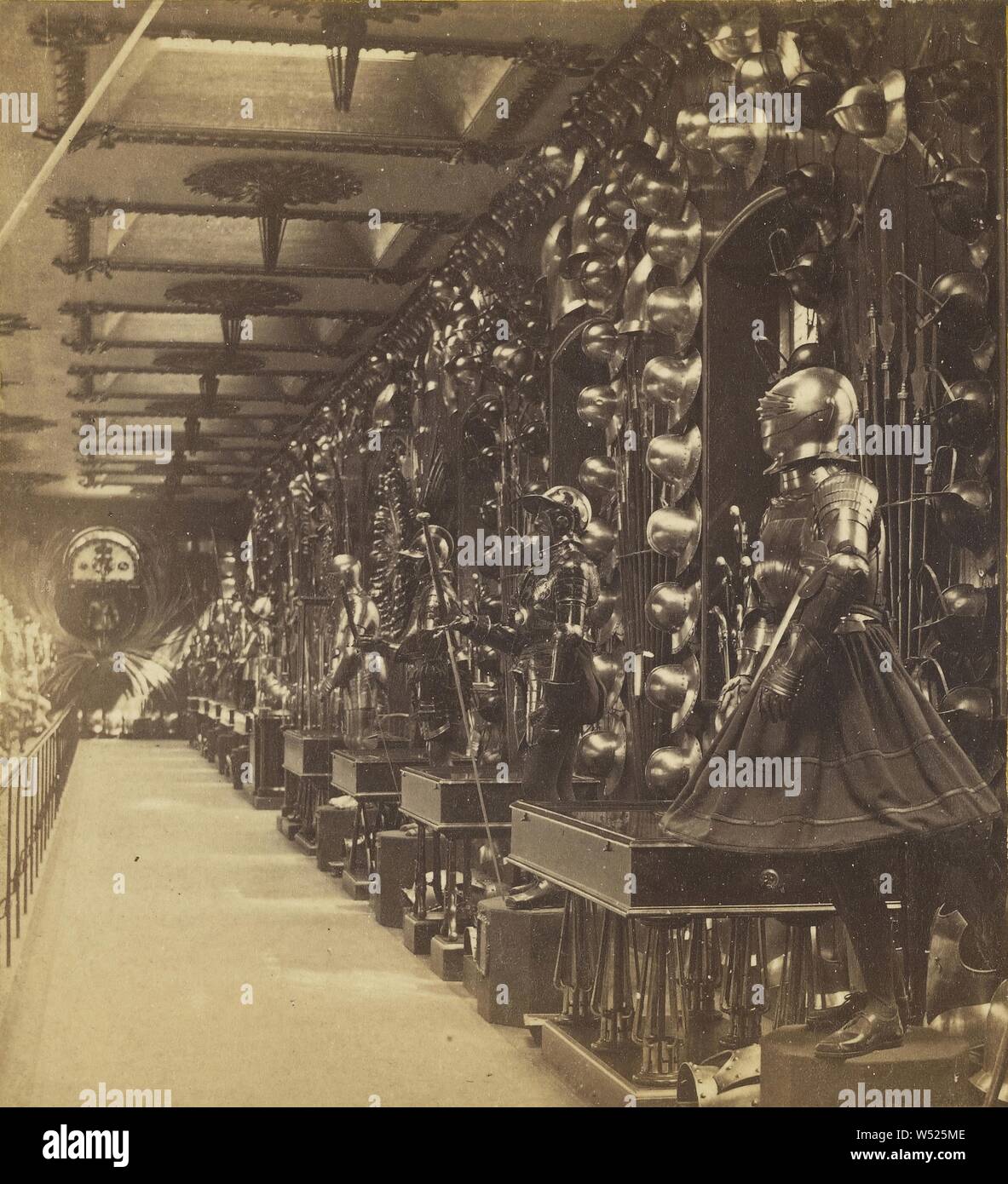 The Tower of London. The Horse Armory...the South Side of the Gallery, with Footmen...walls are profusely decorated...trophies., James Davis Burton (British, active 1860s), about 1864, Albumen silver print Stock Photo