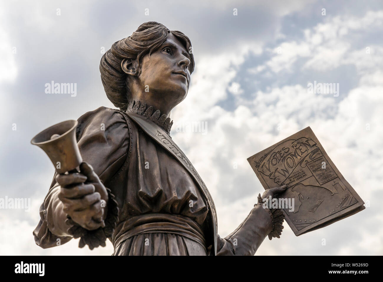 Bronze statue of Annie Kenny political activist and homegrown suffragette for the Women's Social and Political Union in the centre of Oldham, England. Stock Photo