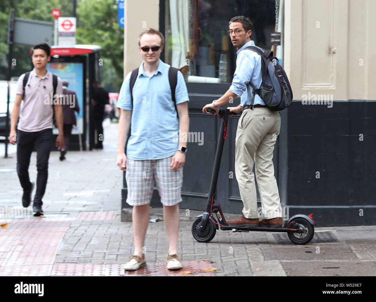 An e scooter rider on pavement hires stock photography and images Alamy