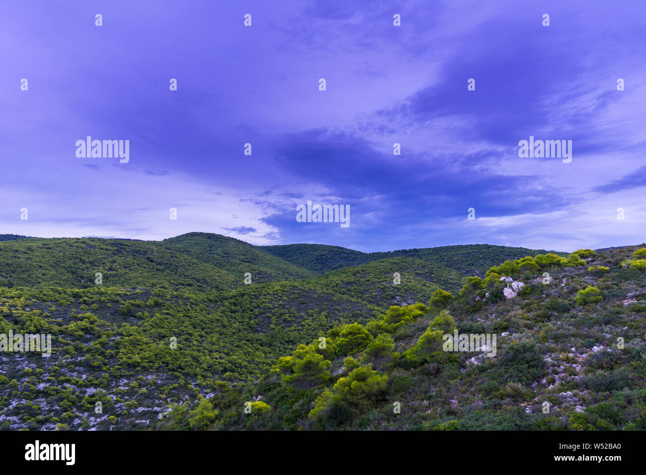 Greece, Zakynthos, Mountain landscape and untouched nature in magical twilight after sunset Stock Photo