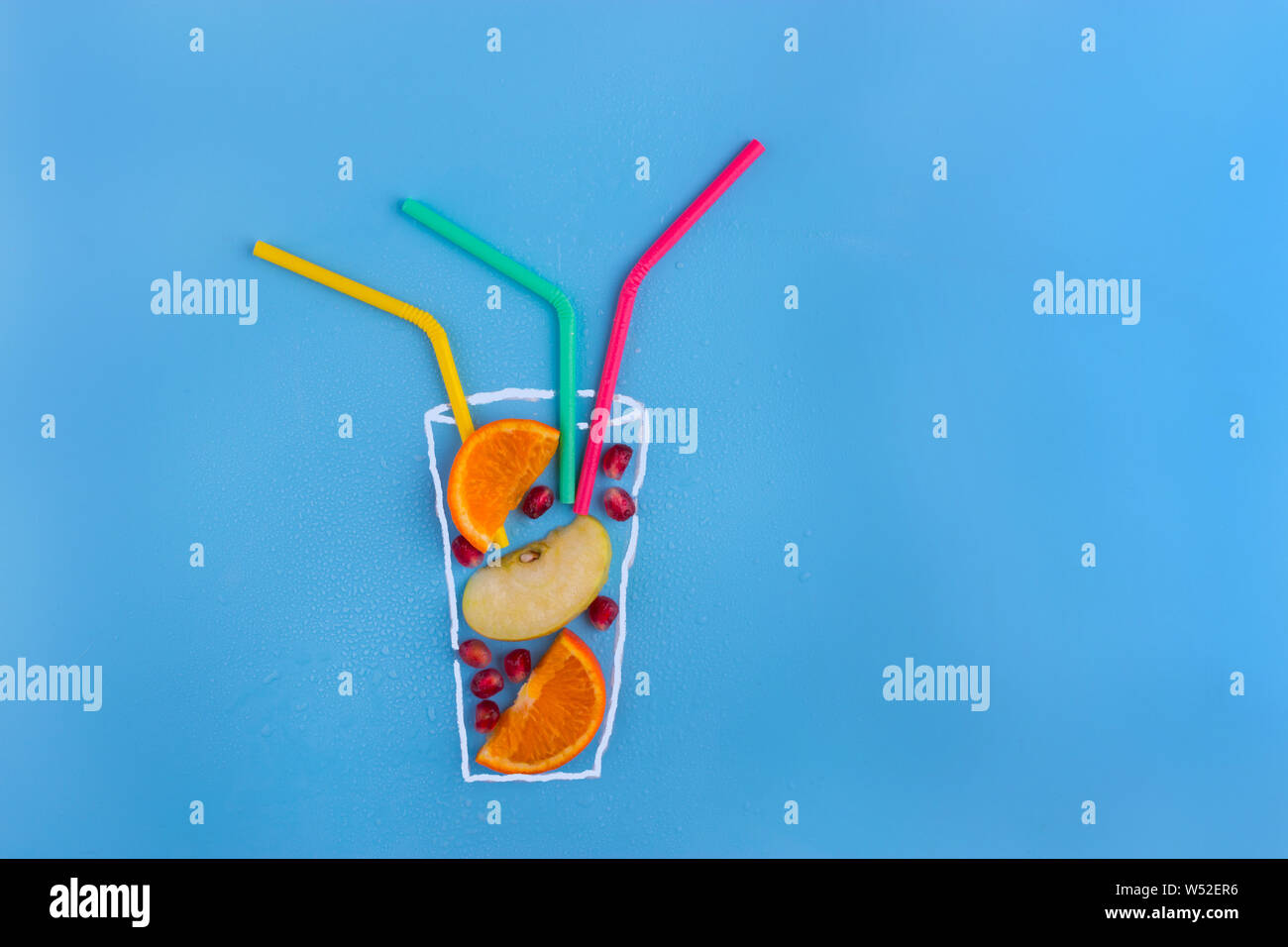 Fruit cocktail on blue background. Art elements in the image Stock ...