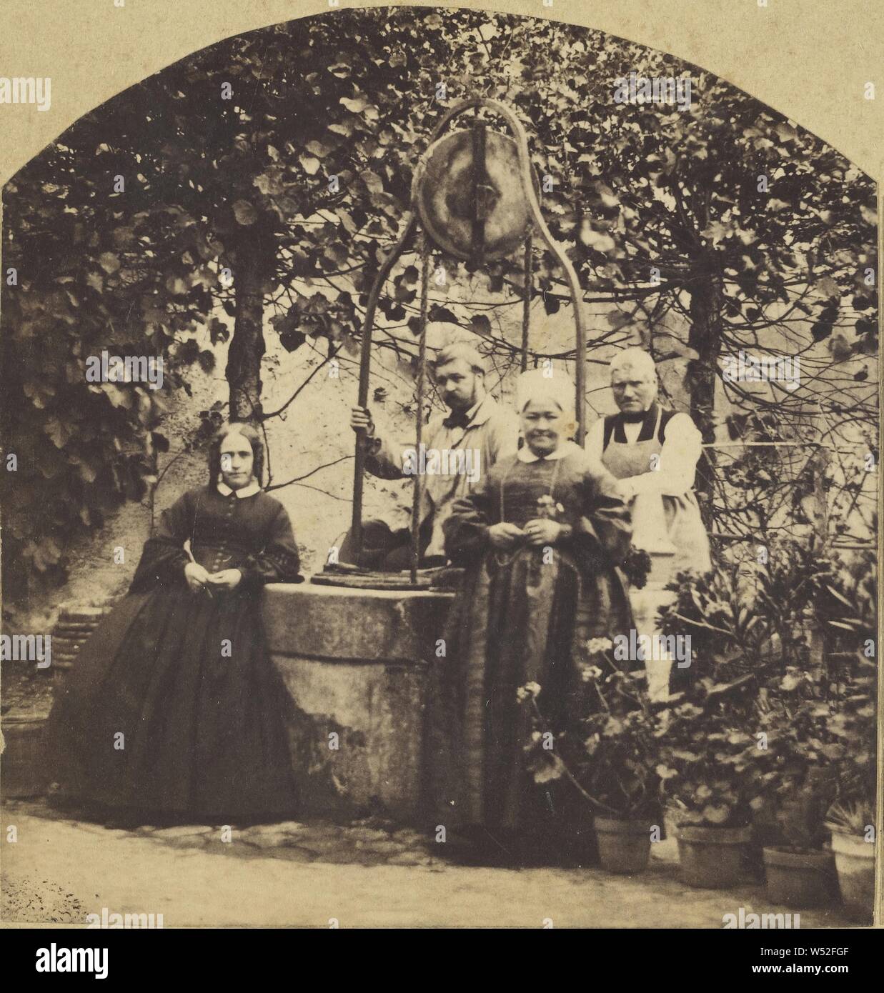 Young French couple and two elders standing in their garden near a well, Henry Van Der Helle (French, active 1870s), about 1877, Albumen silver print Stock Photo