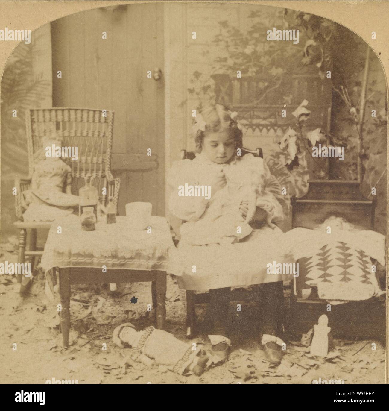 Little girl playing with dolls, Unknown, about 1860, Albumen silver print Stock Photo