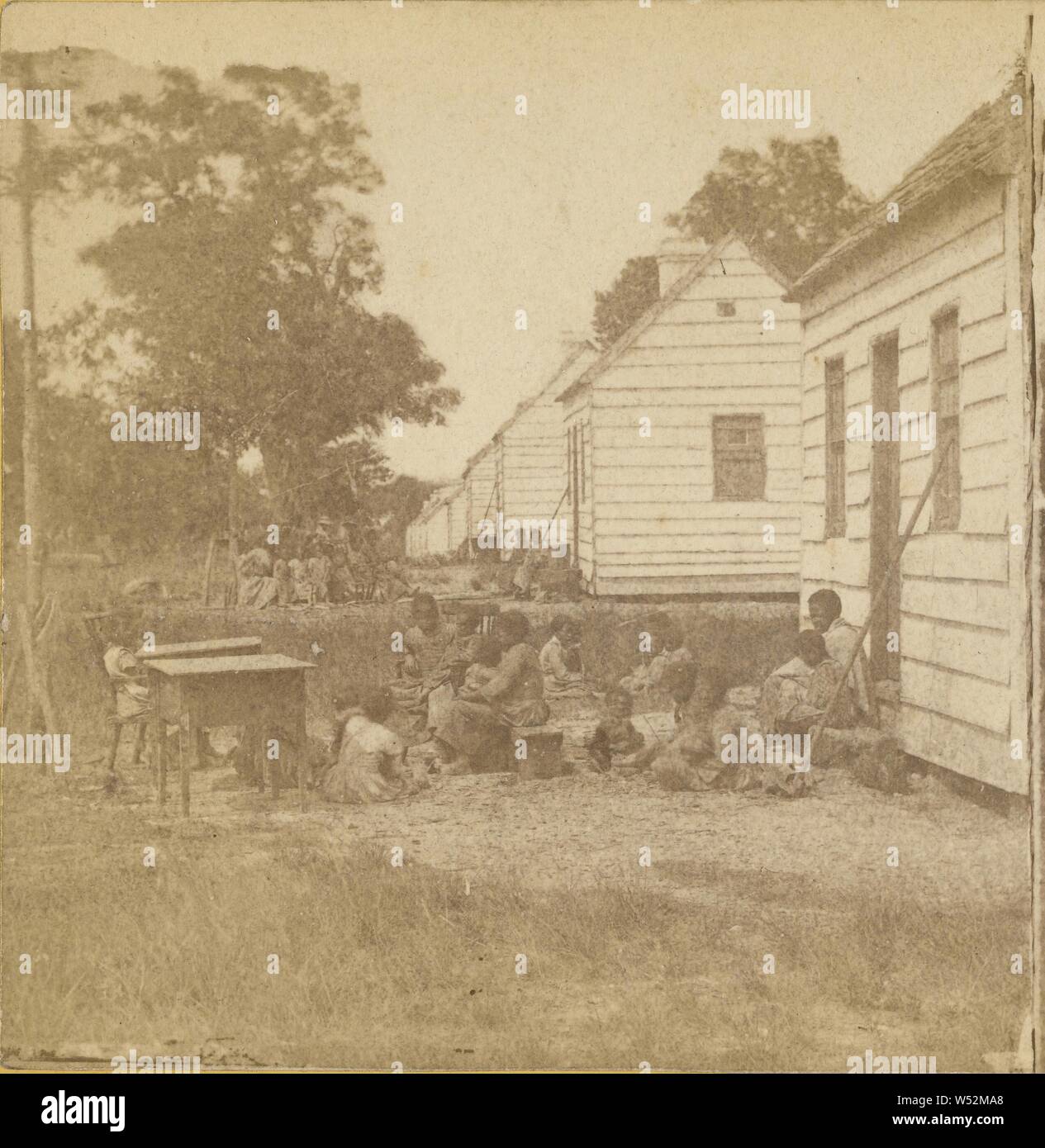 A Plantation Scene, in South Carolina. This picture represents the Negro Quarters on a Plantation, as taken in 1860., Unknown maker, American, 1860, Albumen silver print Stock Photo