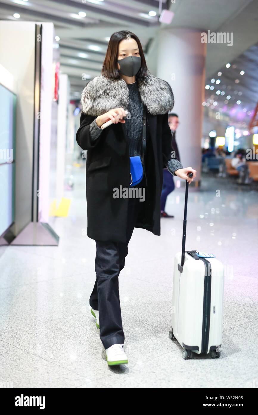 Chinese actress and model Du Juan arrives at an airport in Shanghai ...
