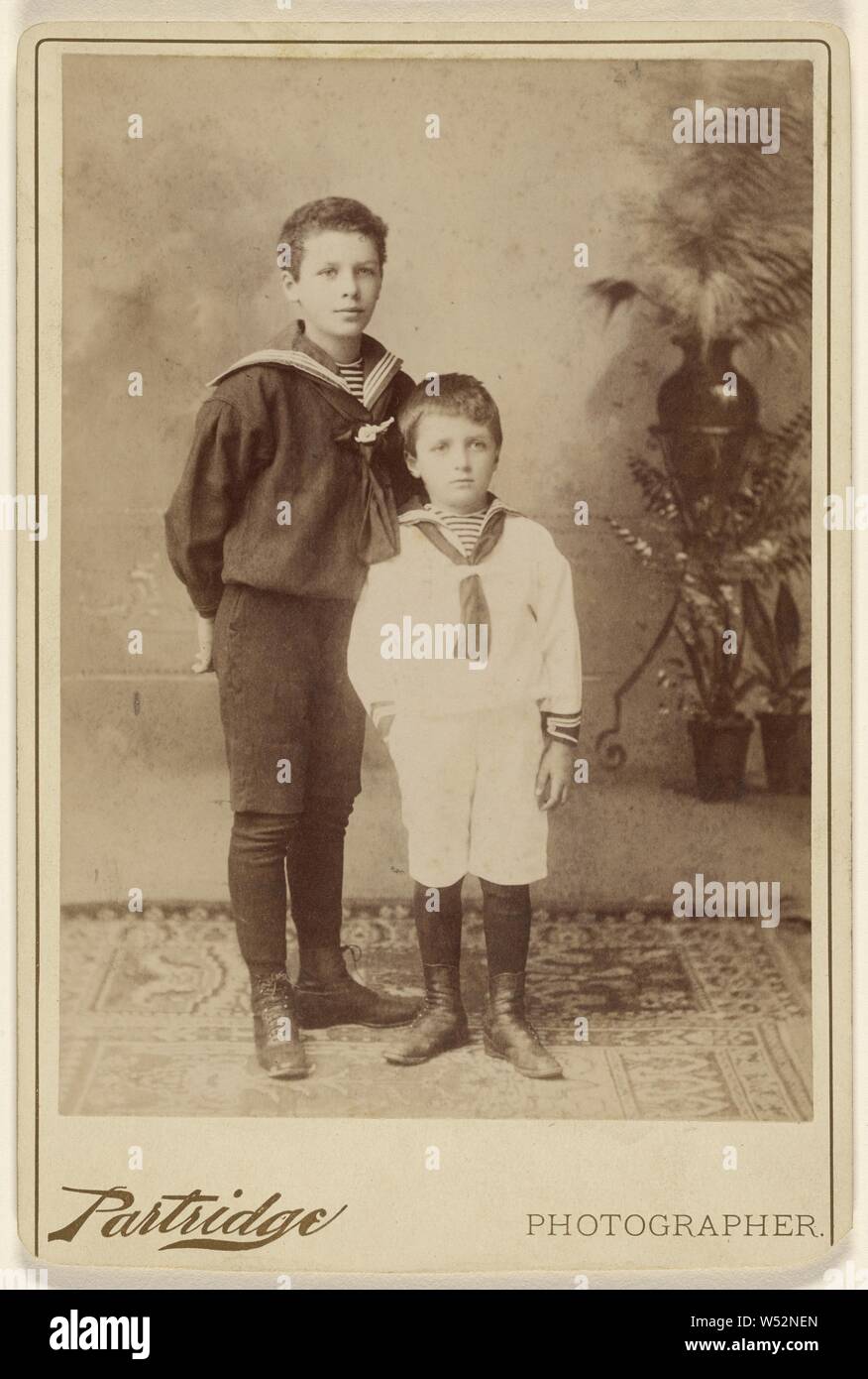 Two young boys standing, both wearing sailor-type outfits, Partridge (American, active Bridgeport, Connecticut 1870s - 1890s), 1890, Albumen silver print Stock Photo