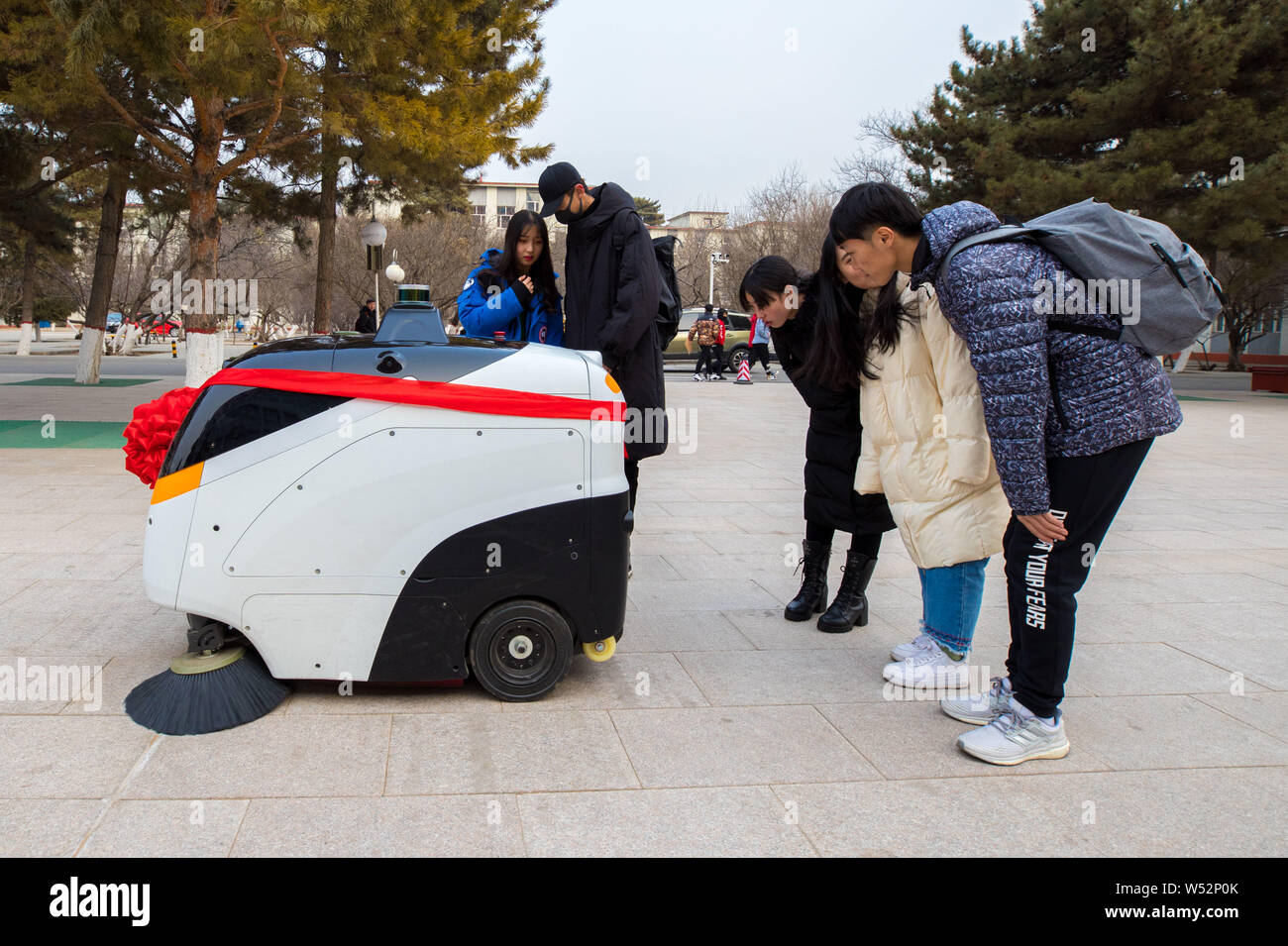 A Level 4 autonomous driving cleaning vehicle works at the campus of Inner Mongolia Normal University in Hohhot, north China's Inner Mongolia Autonomo Stock Photo