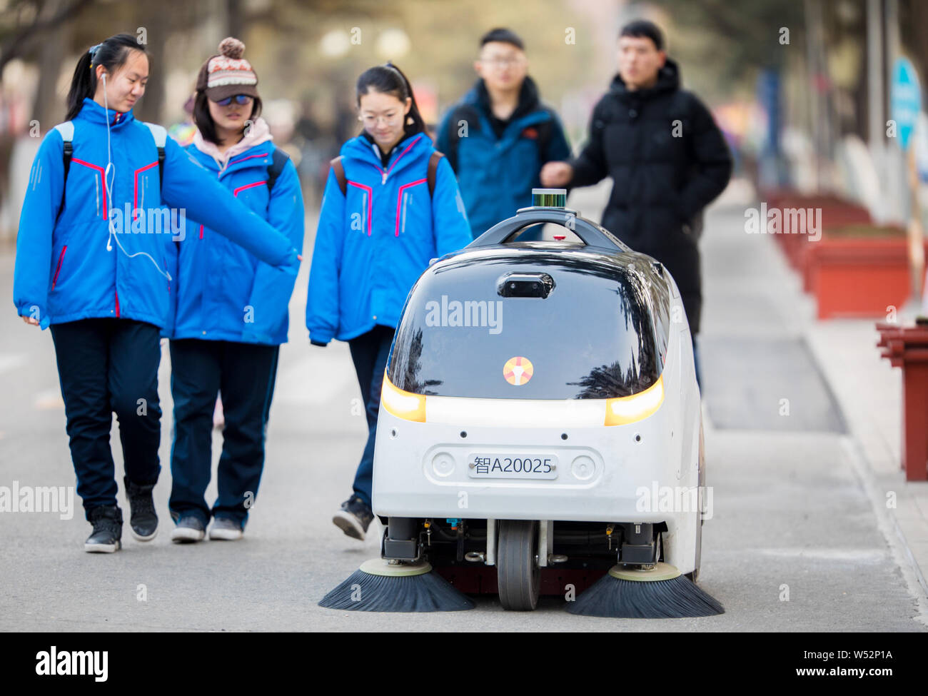 A Level 4 autonomous driving cleaning vehicle works at the campus of Inner Mongolia Normal University in Hohhot, north China's Inner Mongolia Autonomo Stock Photo