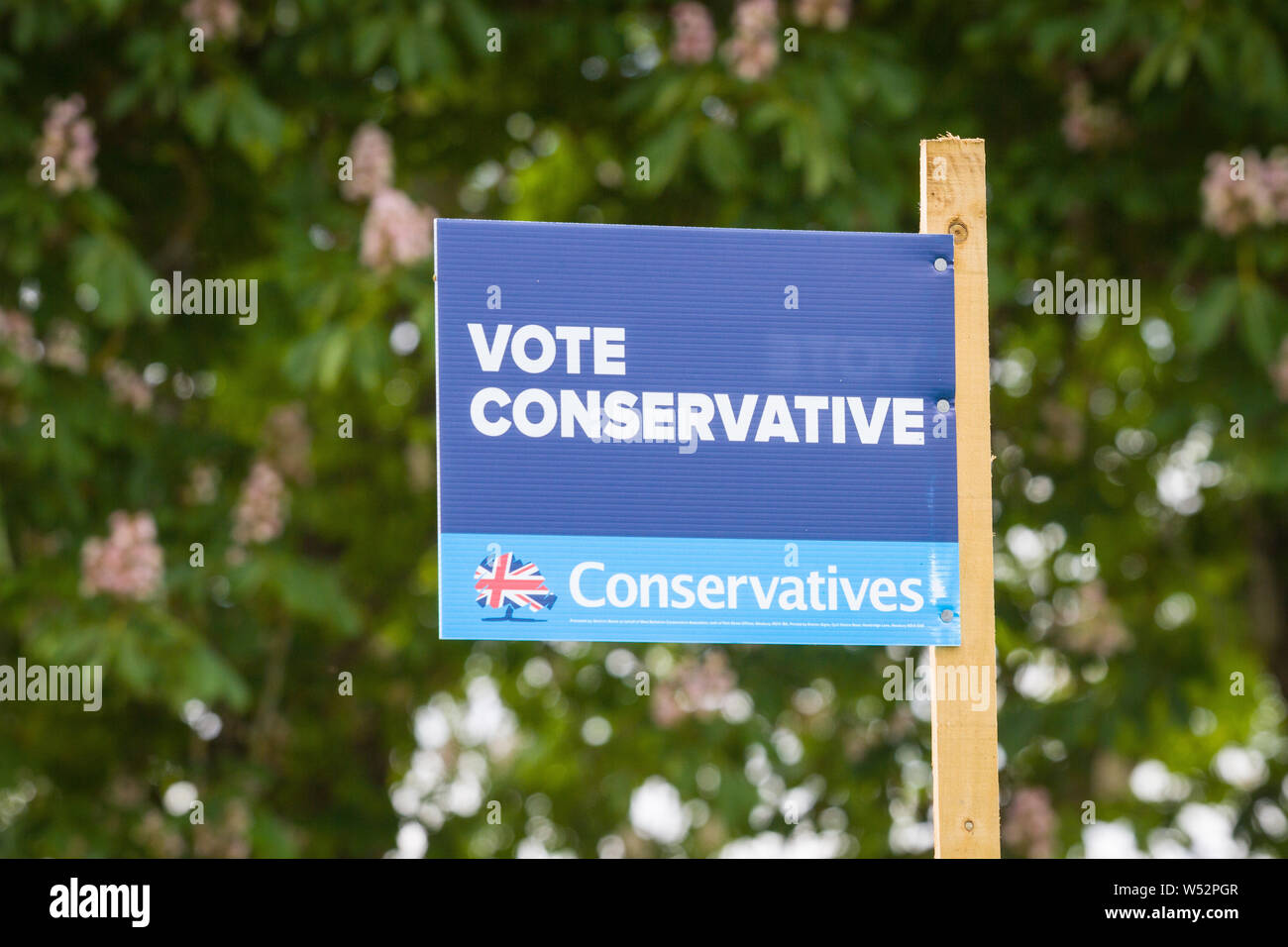 a Vote Conservative sign by a country lane near Yattendon, Berkshire