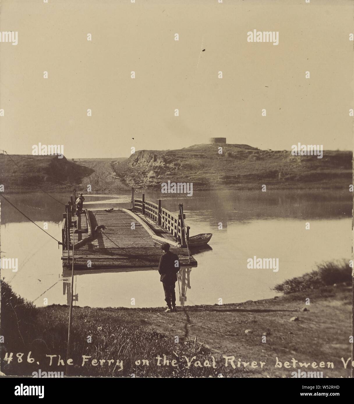 The Ferry on the Vaal River between Vereeniging and Viljoens Drift (recto), Transvaal Gatling Gun Corps (verso), J. Wilbur Read (American, 1866 - 1946), about 1910, Gelatin silver print Stock Photo