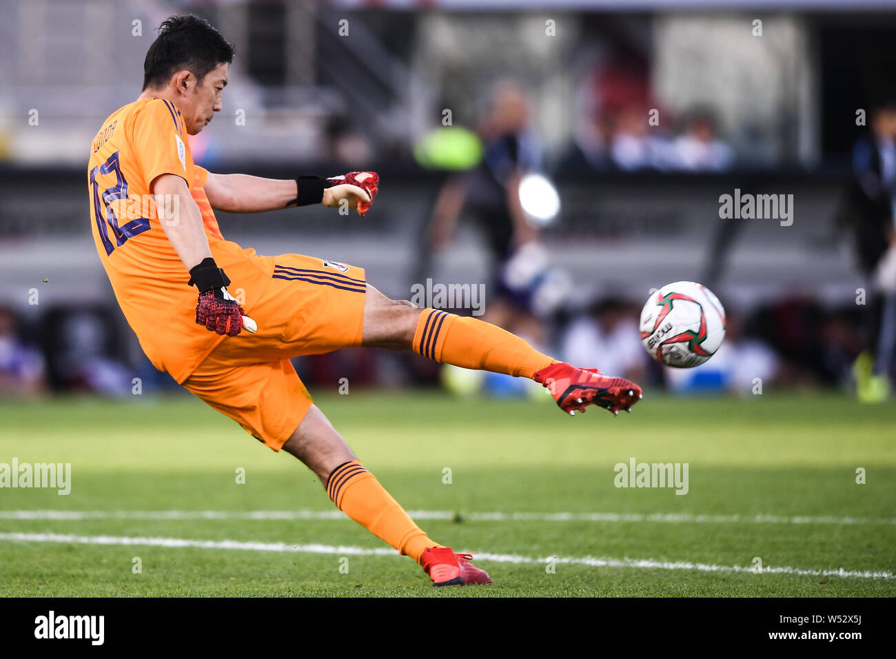 Shuichi Gonda of Japan national football team kicks the ball against Turkmenistan national football team in their AFC Asian Cup group F match in Abu D Stock Photo