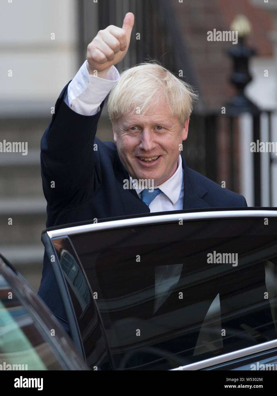 Newly elected leader of the Conservative party Boris Johnson gestures at Conservative party HQ in Westminster on July 23, 2019 in London, England. After a month of hustings, campaigning and televised debates the members of the UK's Conservative and Unionist Party have voted for Boris Johnson to be their new leader and the country's next Prime Minister, replacing Theresa May Stock Photo