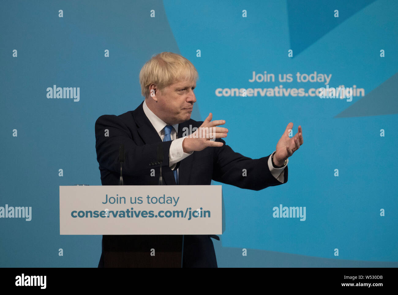Newly elected British Prime Minister Boris Johnson speaks during the Conservative Leadership announcement at the QEII Centre on July 23, 2019 in London, England. After a month of hustings, campaigning and televised debates the members of the UK's Conservative and Unionist Party have voted for Boris Johnson to be their new leader and the country's next Prime Minister, replacing Theresa May. Stock Photo