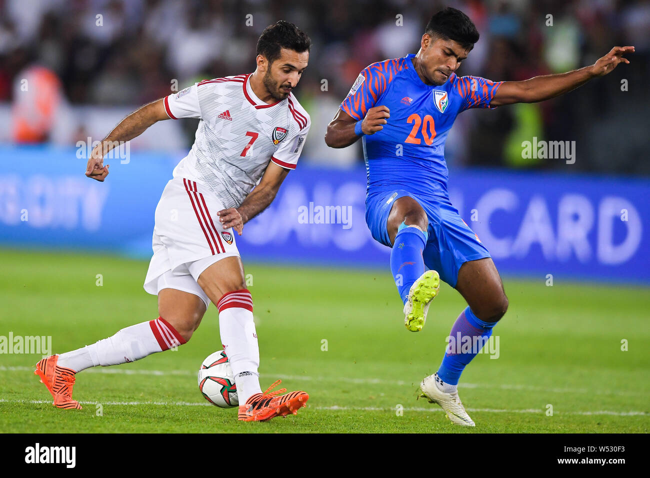 Ali Mabkhout, left, of United Arab Emirates national football team passes  the ball against Pritam Kotal of India national football team in the AFC  Asi Stock Photo - Alamy