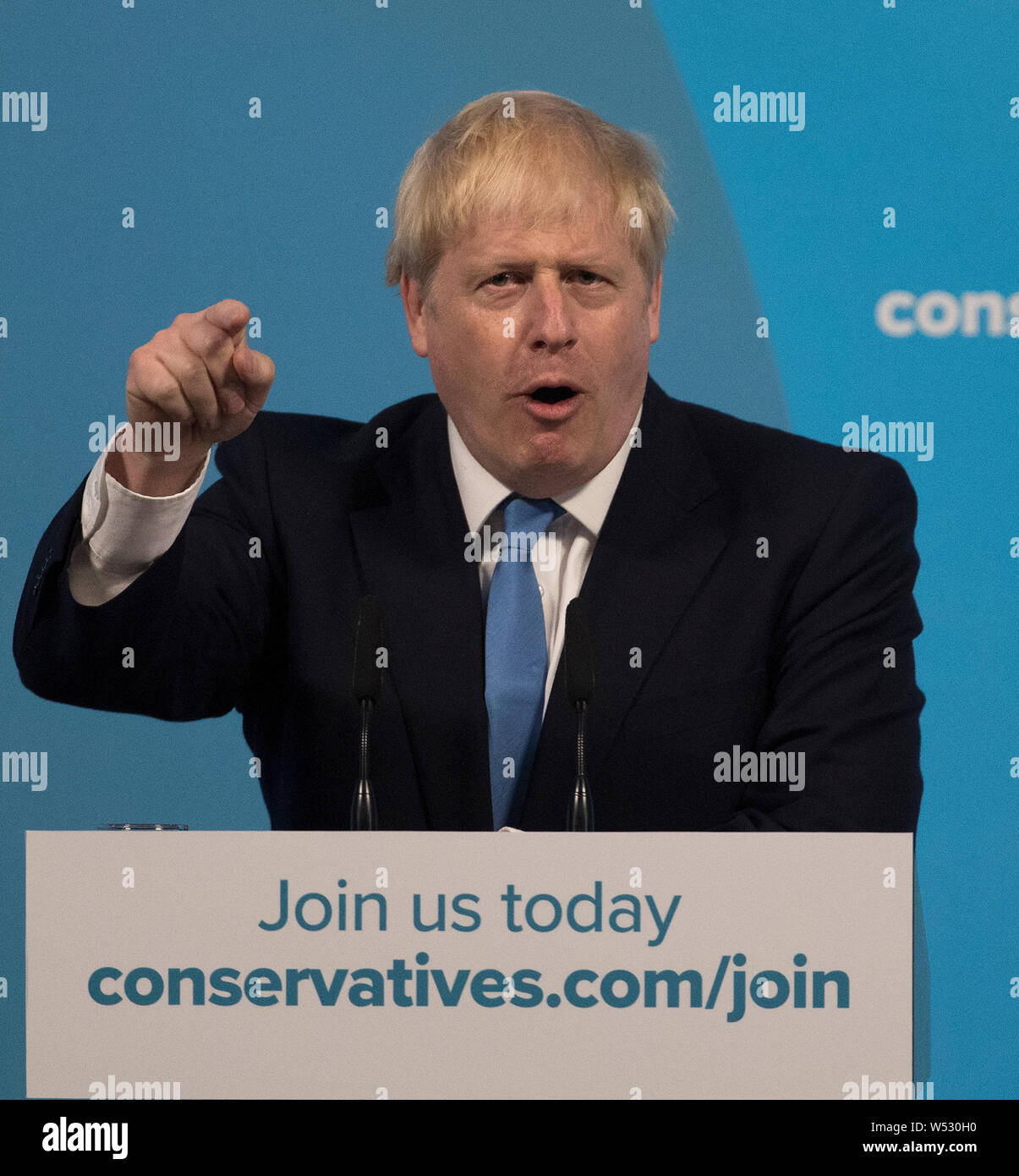 Newly elected British Prime Minister Boris Johnson speaks during the Conservative Leadership announcement at the QEII Centre on July 23, 2019 in London, England. After a month of hustings, campaigning and televised debates the members of the UK's Conservative and Unionist Party have voted for Boris Johnson to be their new leader and the country's next Prime Minister, replacing Theresa May. Stock Photo