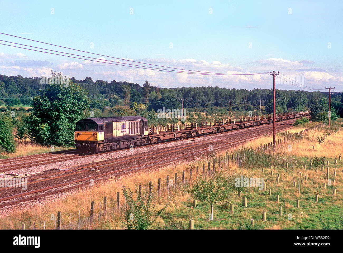 A class 58 diesel locomotive number 58041 working a departmental train at Lower Basildon in the Thames Valley on the 10th August 2001. Stock Photo