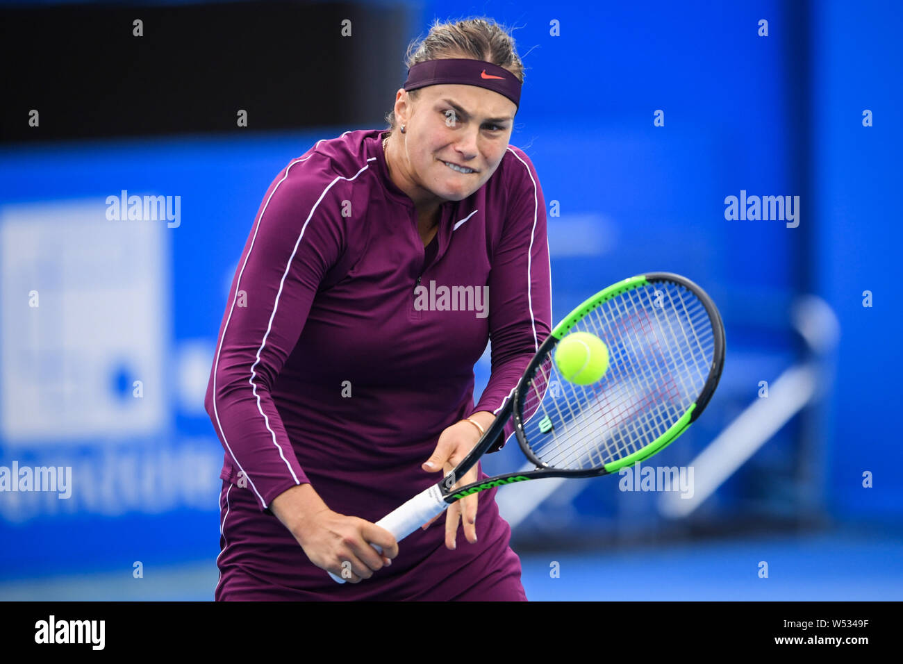 Aryna Sabalenka of Belarus returns a shot to Ekaterina Alexandrova of