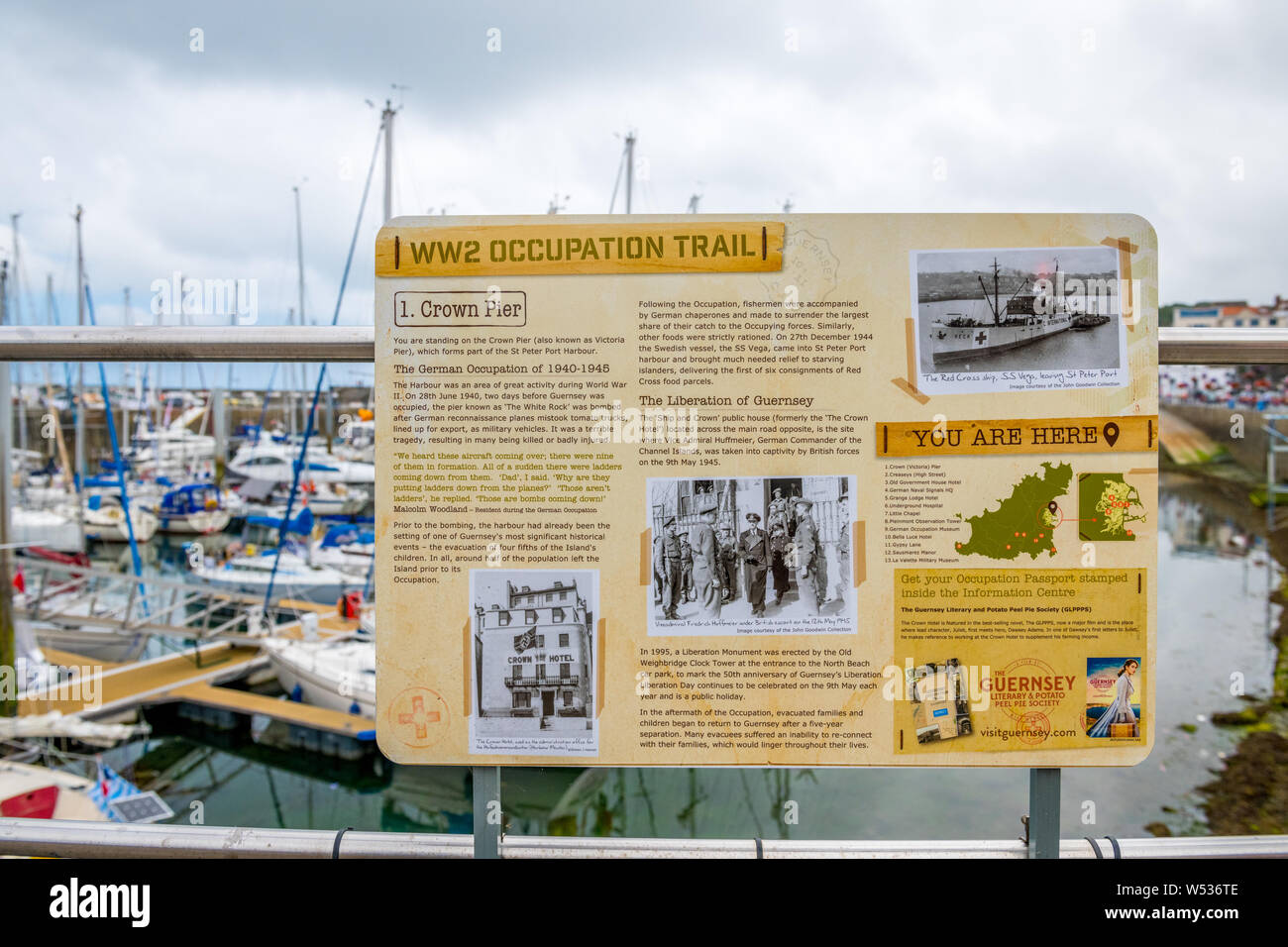 Informantion board in Guernsey informing tourists about the German occupation of Guernsey during the second wolrd war. Stock Photo