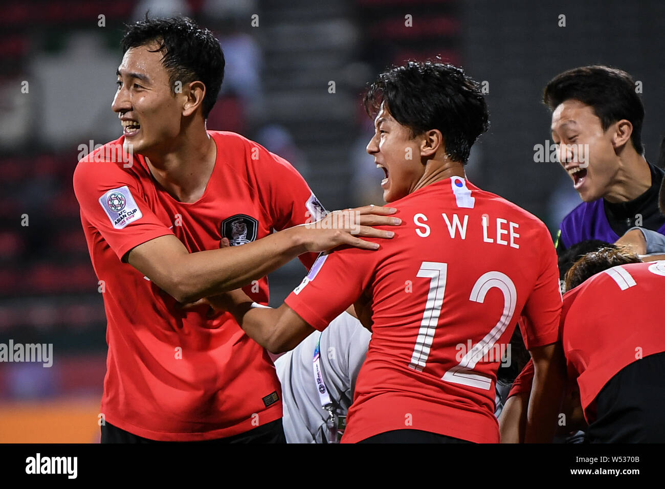 Ji Dong-won, left, and Lee Seung-woo of South Korea celebrate after soring a goal against Bahrain in the round of 16 match between South Korea and Bah Stock Photo