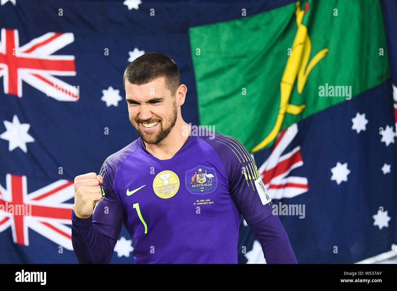 Mathew Ryan of Australia national soccer team celebrates after defeating Uzbekistan national football team in the round of 16 match during the 2019 AF Stock Photo