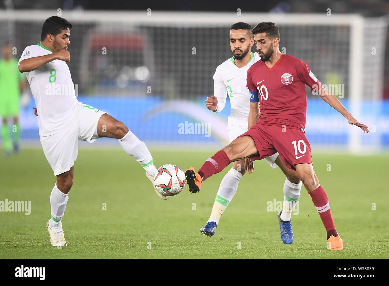 Hassan Al-Haydos, right, of Qatar challenges Yahya Al-Shehri of Saudi Arabia in the 2019 AFC Asian Cup group E football match between Saudi Arabia and Stock Photo