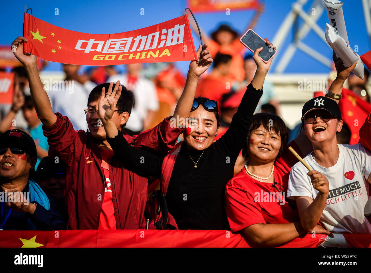 Chinese Football Fans Hold Up Chinese National Flags To Show