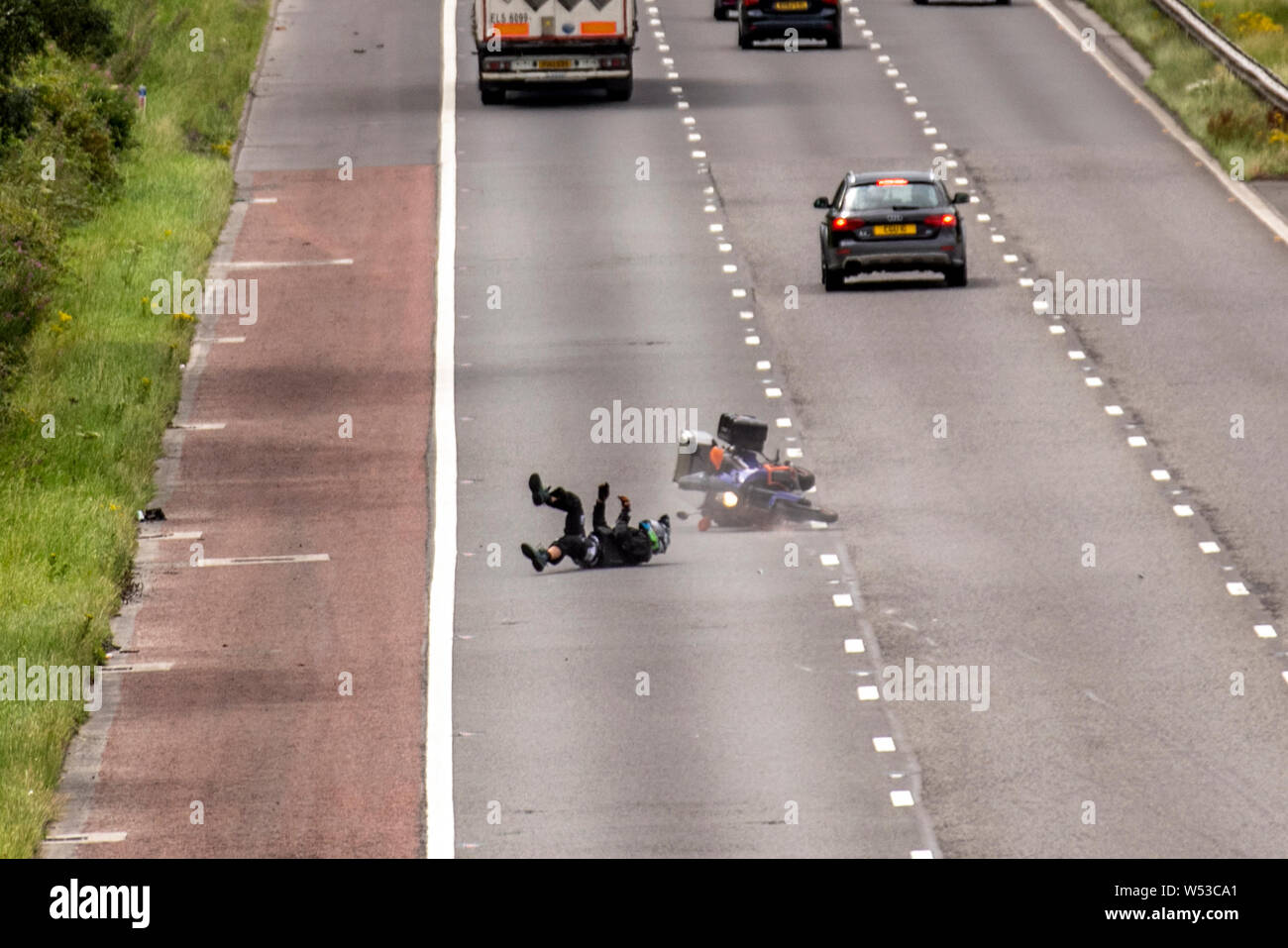 Lancaster, Lancashire. UK Weather. 26th July, 2019. In dry conditions a speeding motorcyclist on the M6 survives a dramatic crash after losing control of his machine crossing all three lanes of the motorway before recovering on the hard shoulder, Credit; MediaWorldImages/AlamyLiveNews Stock Photo