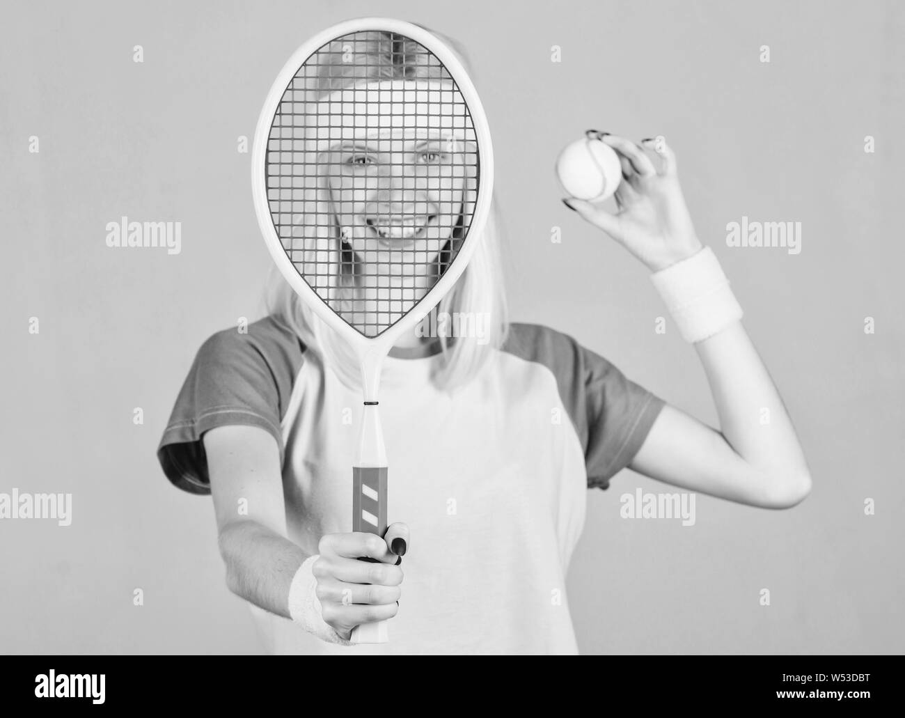 Tennis club concept. Tennis sport and entertainment. Active leisure and hobby. Girl fit slim blonde play tennis. Sport for maintaining health. Active lifestyle. Woman hold tennis racket in hand. Stock Photo