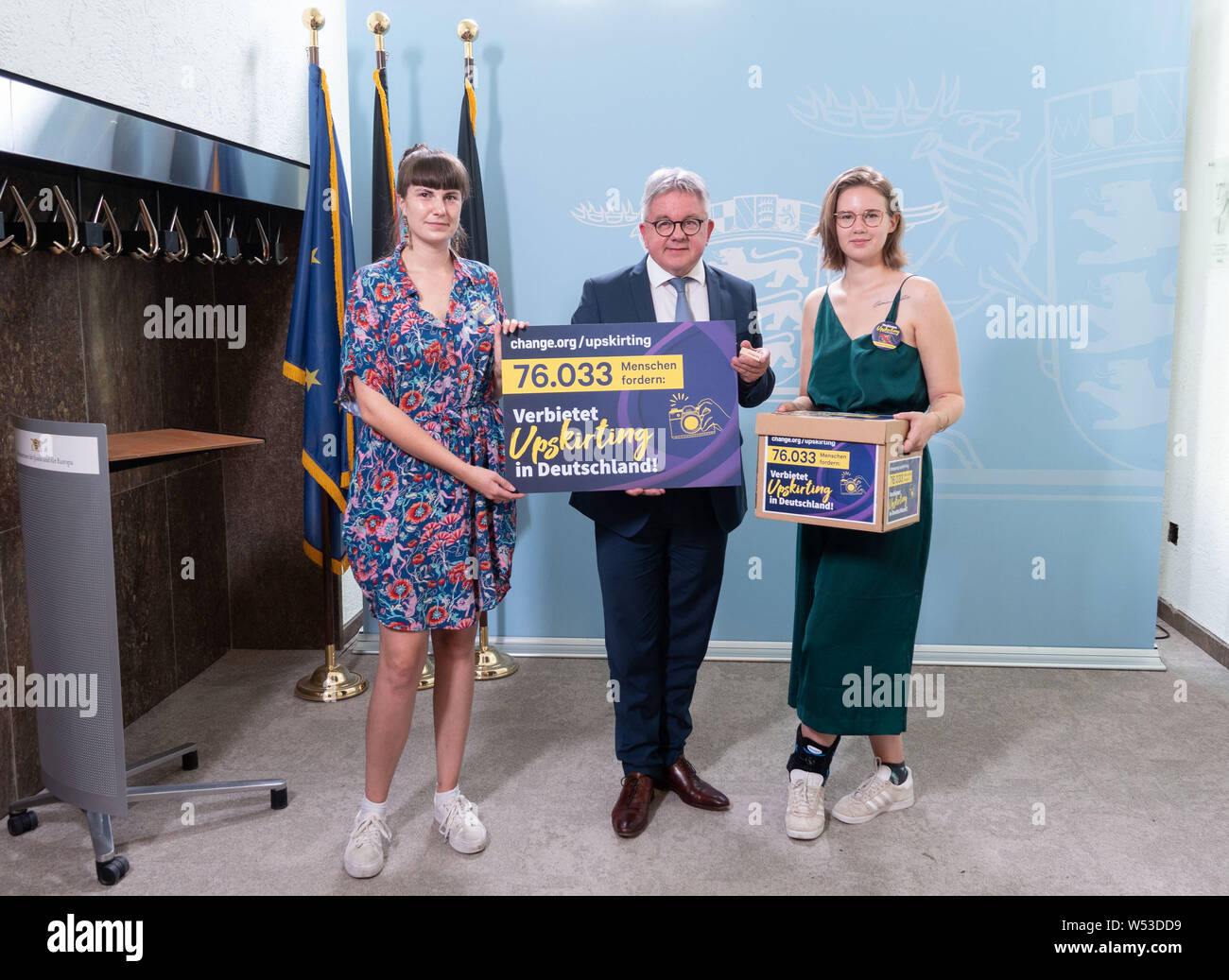 Stuttgart, Germany. 26th July, 2019. Hanna Seidel (l) and Ida Marie Sassenberg (r), initiators of the petition 'Prohibits #Upskirting in Germany', meet Guido Wolf (CDU), Minister of Justice of Baden-Württemberg, during a press conference. A few months ago they launched a petition against voyeuristic photography and filming under skirts and dresses. Credit: Linda Vogt/dpa/Alamy Live News Stock Photo