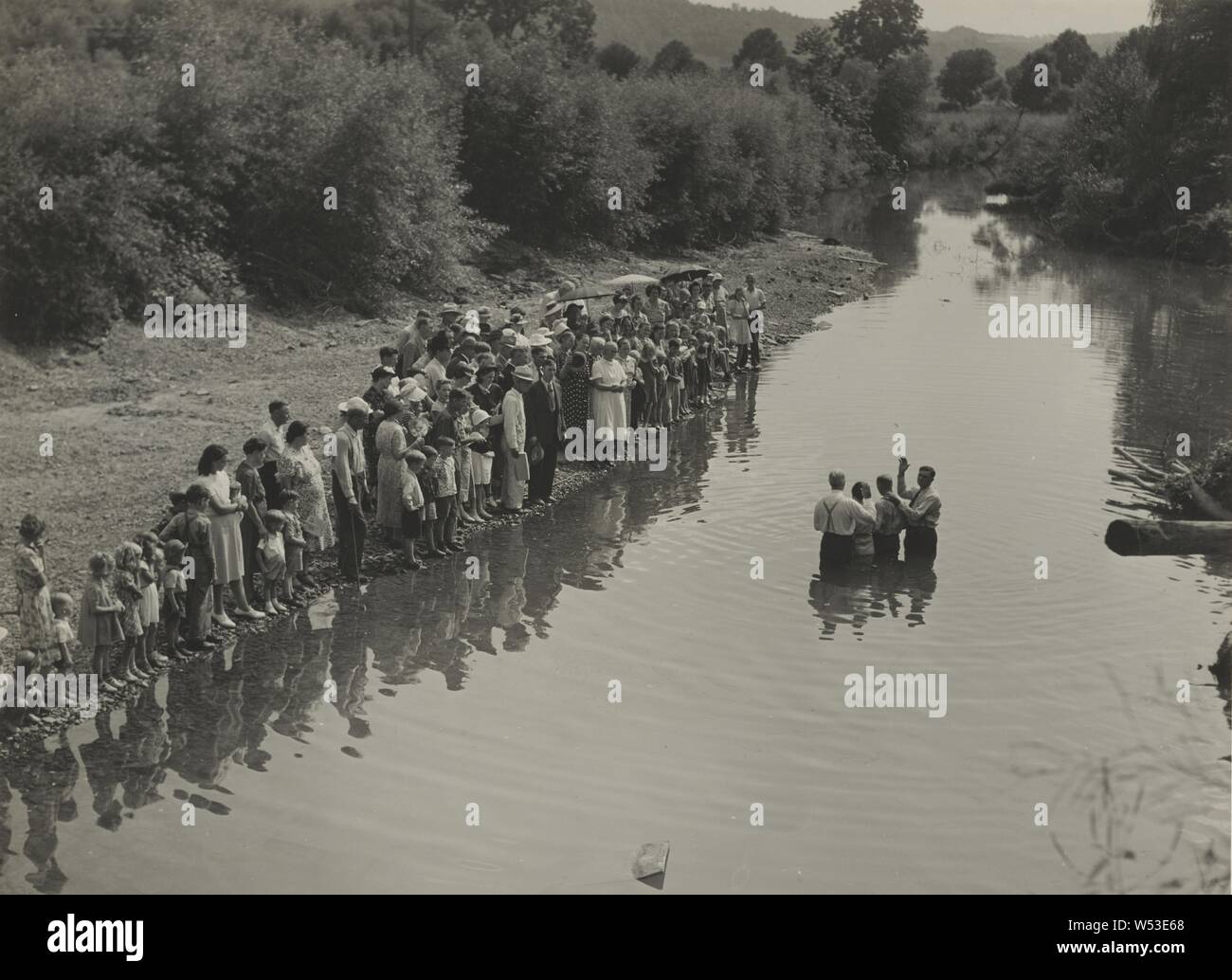 Members of the Primitive Baptist Church in Moorehead sic, Kentucky, Attending a Creek Baptism by Submersion, August 1940, Marion Post Wolcott (American, 1910 - 1990), Morehead, Kentucky, United States, August 1940, Gelatin silver print, 17.8 × 24.4 cm (7 × 9 5/8 in Stock Photo