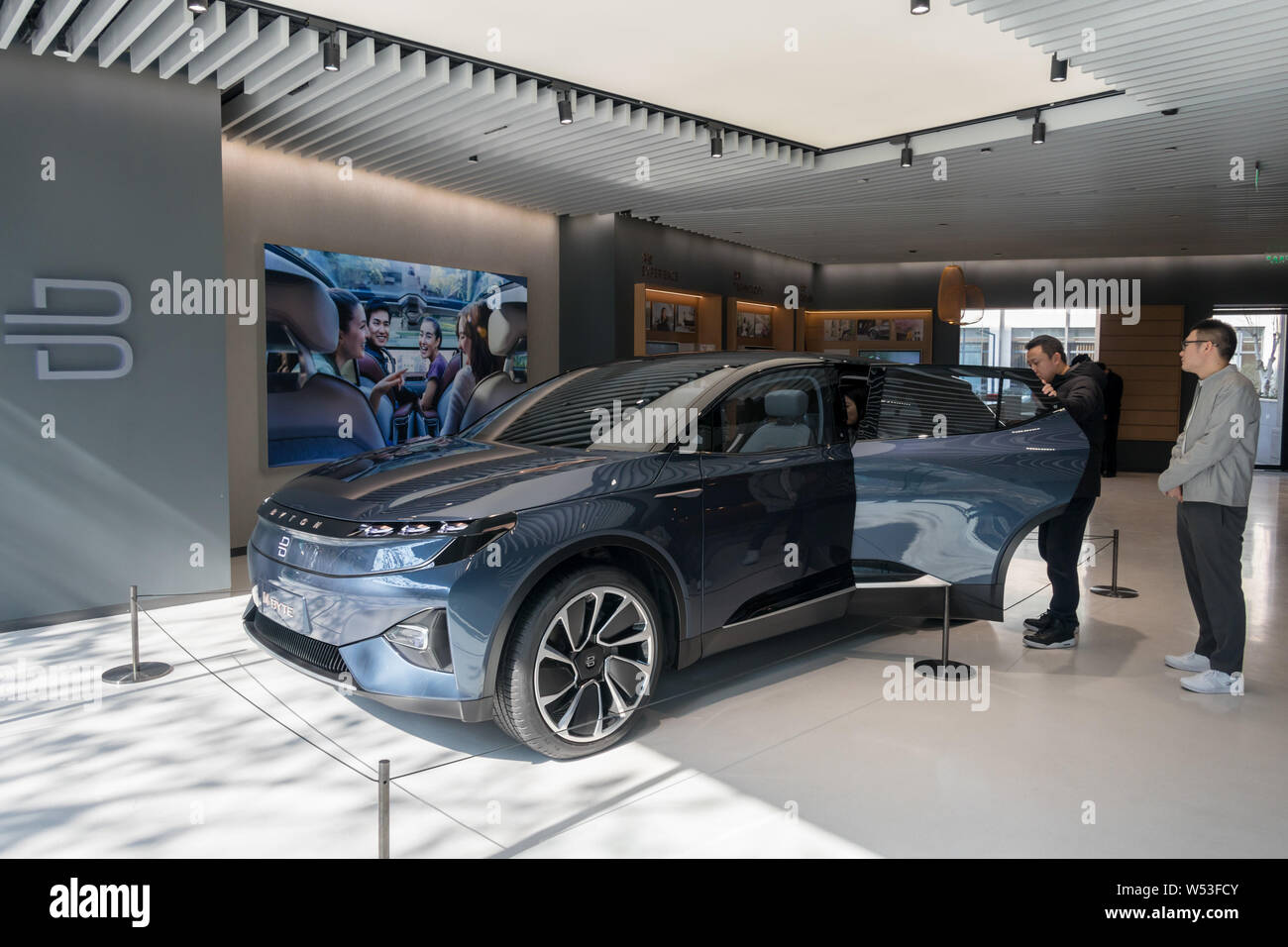 Visitors try out a M-Byte Concept EV (electric vehicle) of Byton at ...