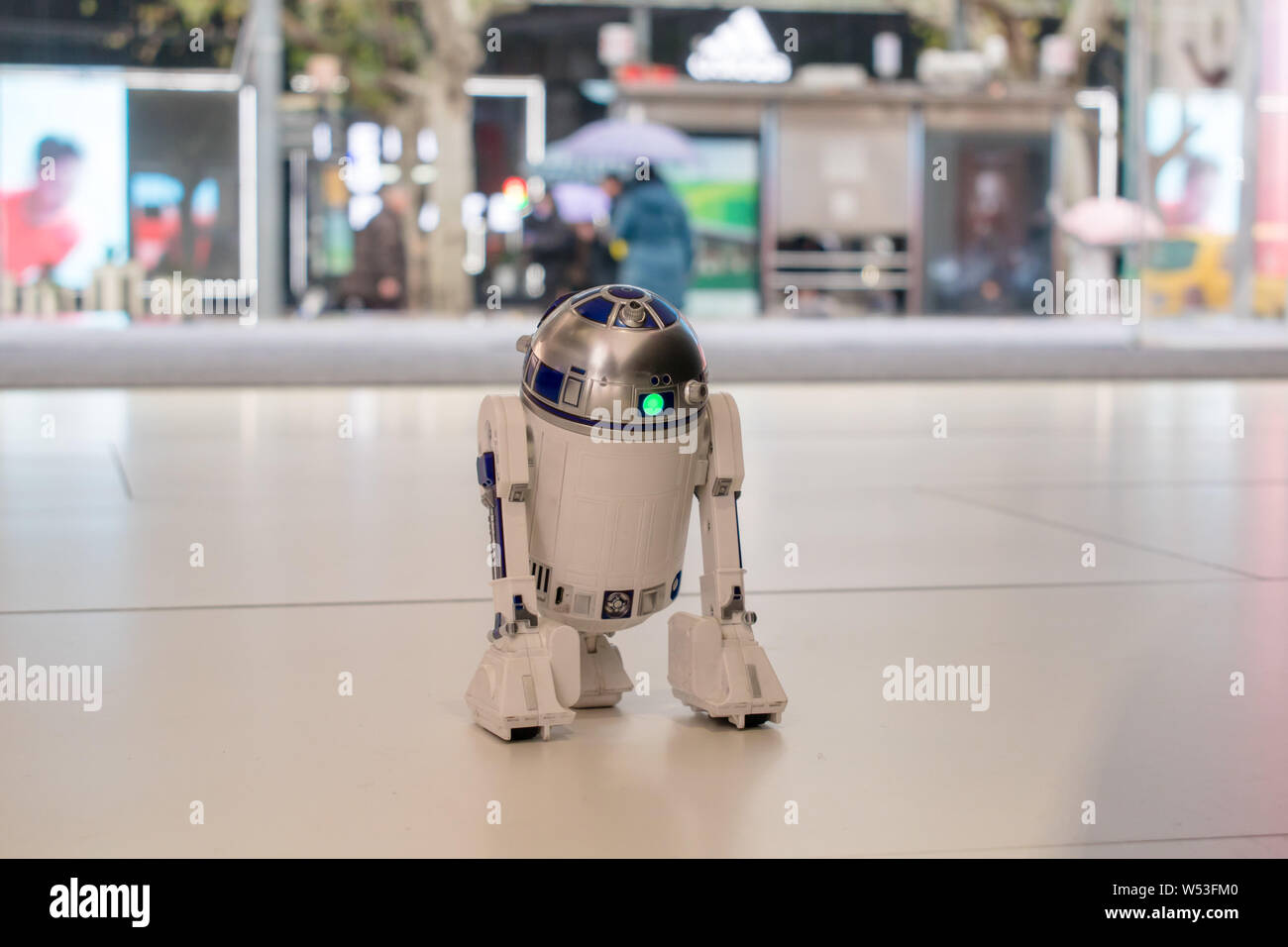 A robot featuring the shape of Star Wars Interactive R2D2 Astromech Droid  Robot patrols at a shopping mall on Huaihai Road in Shanghai, China, 9  Janua Stock Photo - Alamy