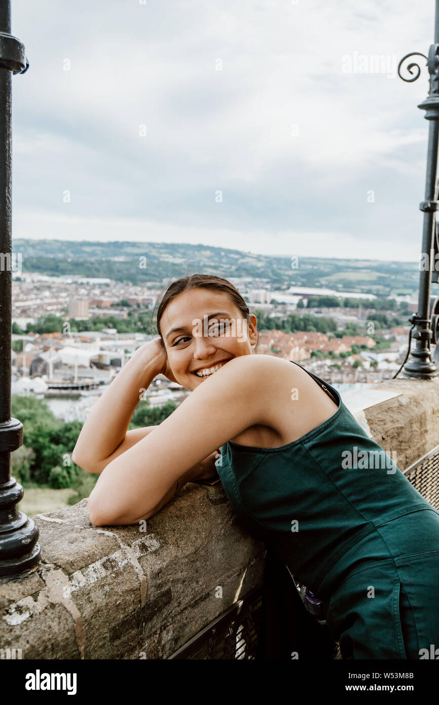 A young woman at Cabot Tower in Brandon Hill Park in Bristol, South West England Stock Photo