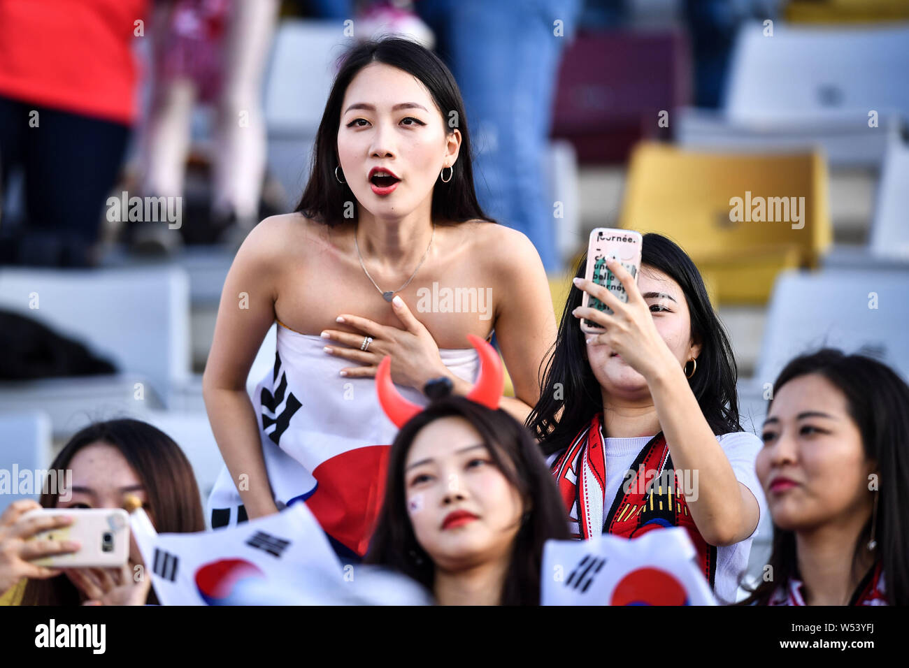 A South Korean football fan wearing the national flag shows support for ...