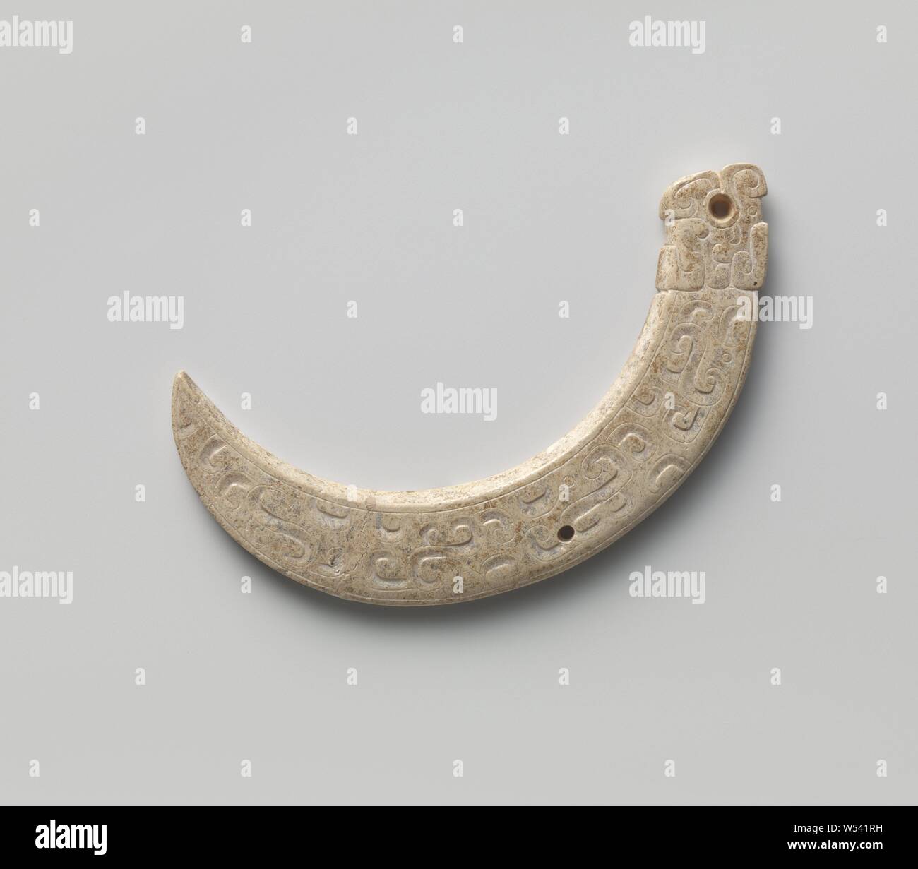 Decorative object, Ornament in cream-colored jade, presumably tail fragment of a mythical animal., anonymous, China, -500 - -200, Zhou-dynasty (1050 B.C.-221 B.C.), jade (rock), w 6.8 cm × h 6.0 cm × d 0.4 cm Stock Photo