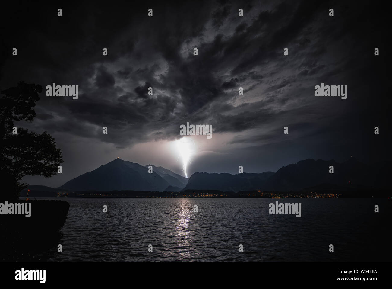 Thunderstorm with lightning over Lake Thun and Niesen Stock Photo