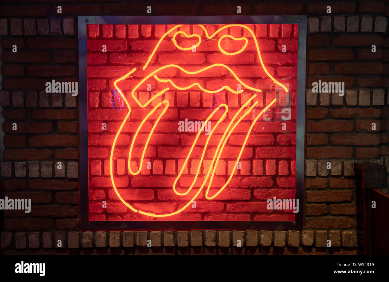 Rock Lips with Tongue out with Neon Light Stock Photo