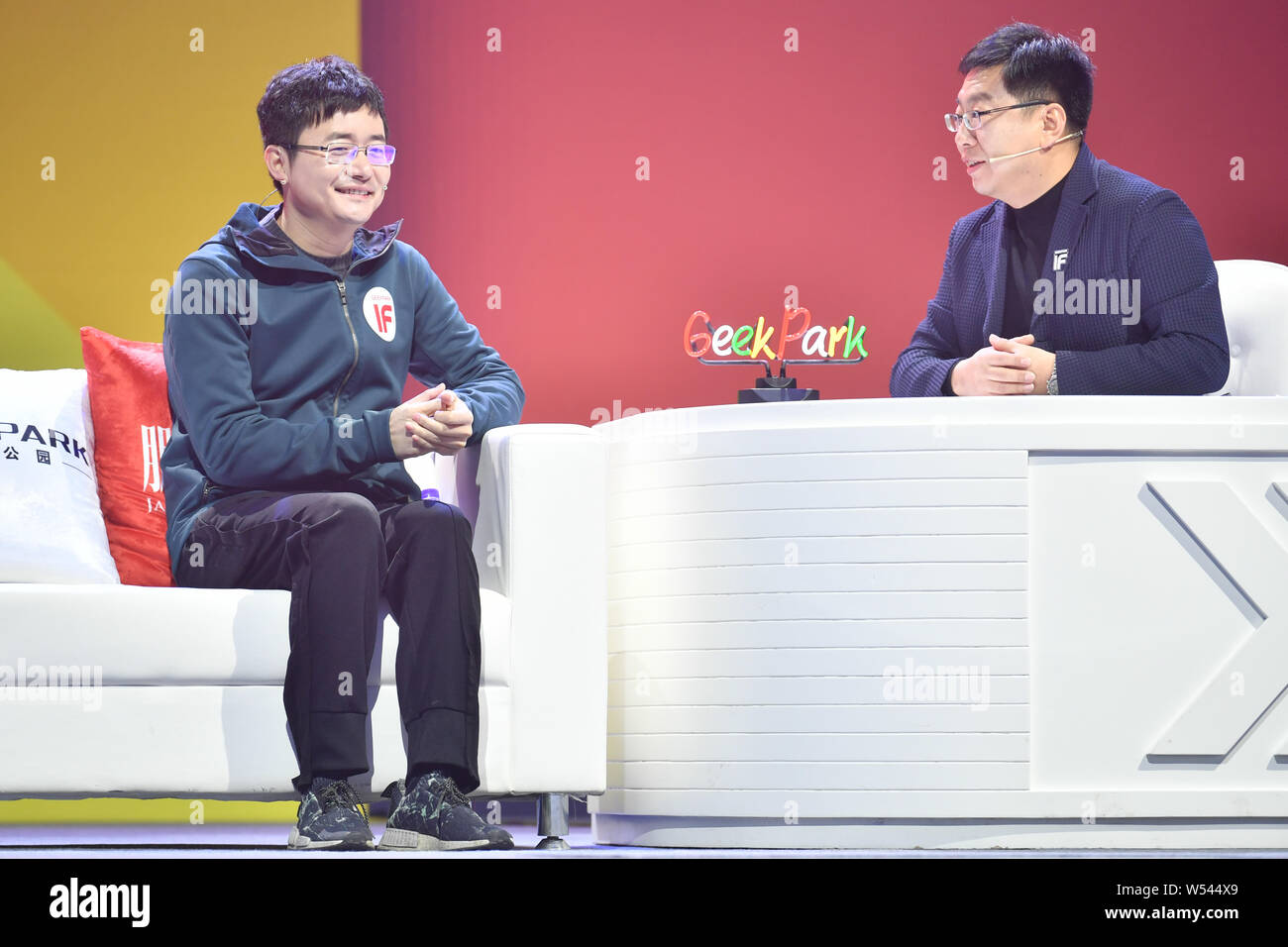 Zhang Peng, right, Founder and President of GeekPark, one of the biggest tech media and innovators' communities, talks with Fu Sheng, Chief Executive Stock Photo