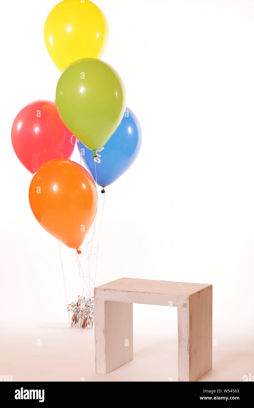 Studio backdrop seat and  balloons Stock Photo