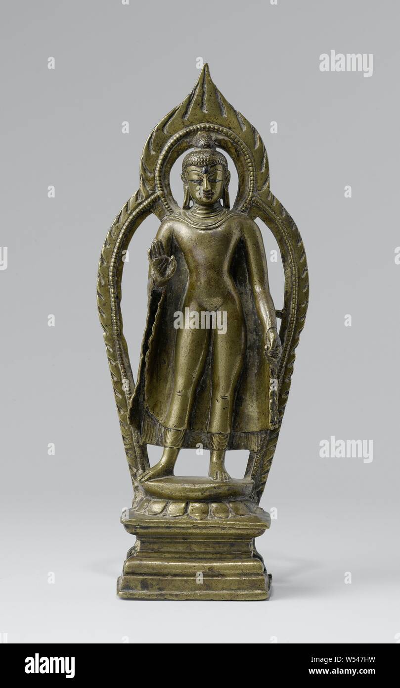 Buddha, Gautama Buddha standing on Lotus cushion, a small flame halo around the head and a large around the body, founder or Buddhism, anonymous, Kashmir, c. 800 - c. 1000, brass (alloy), h 23.0 cm × w 5.0 cm Stock Photo